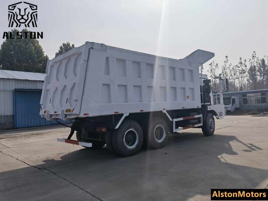Camión volquete minero HOWO 6x4 de fuselaje ancho usado en venta en Guinea